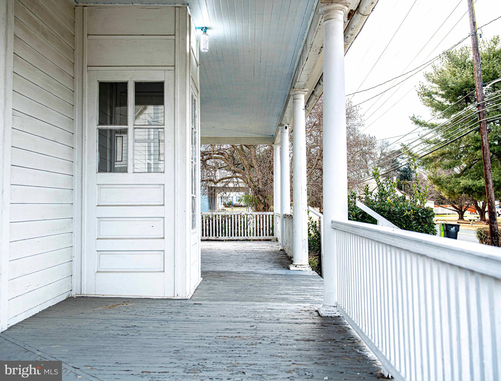 1531 Perryman Road Aberdeen, MD 21001 - Photo 4 of 23 a view of a porch with wooden floor and fence