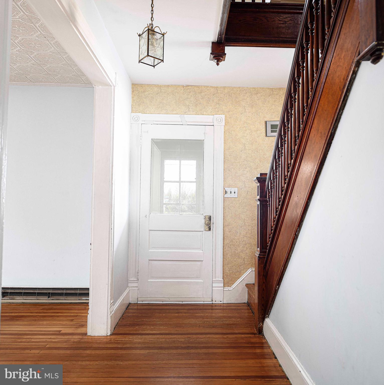 1531 Perryman Road Aberdeen, MD 21001 - Photo 5 of 23 a view of a hallway with wooden floor and staircase