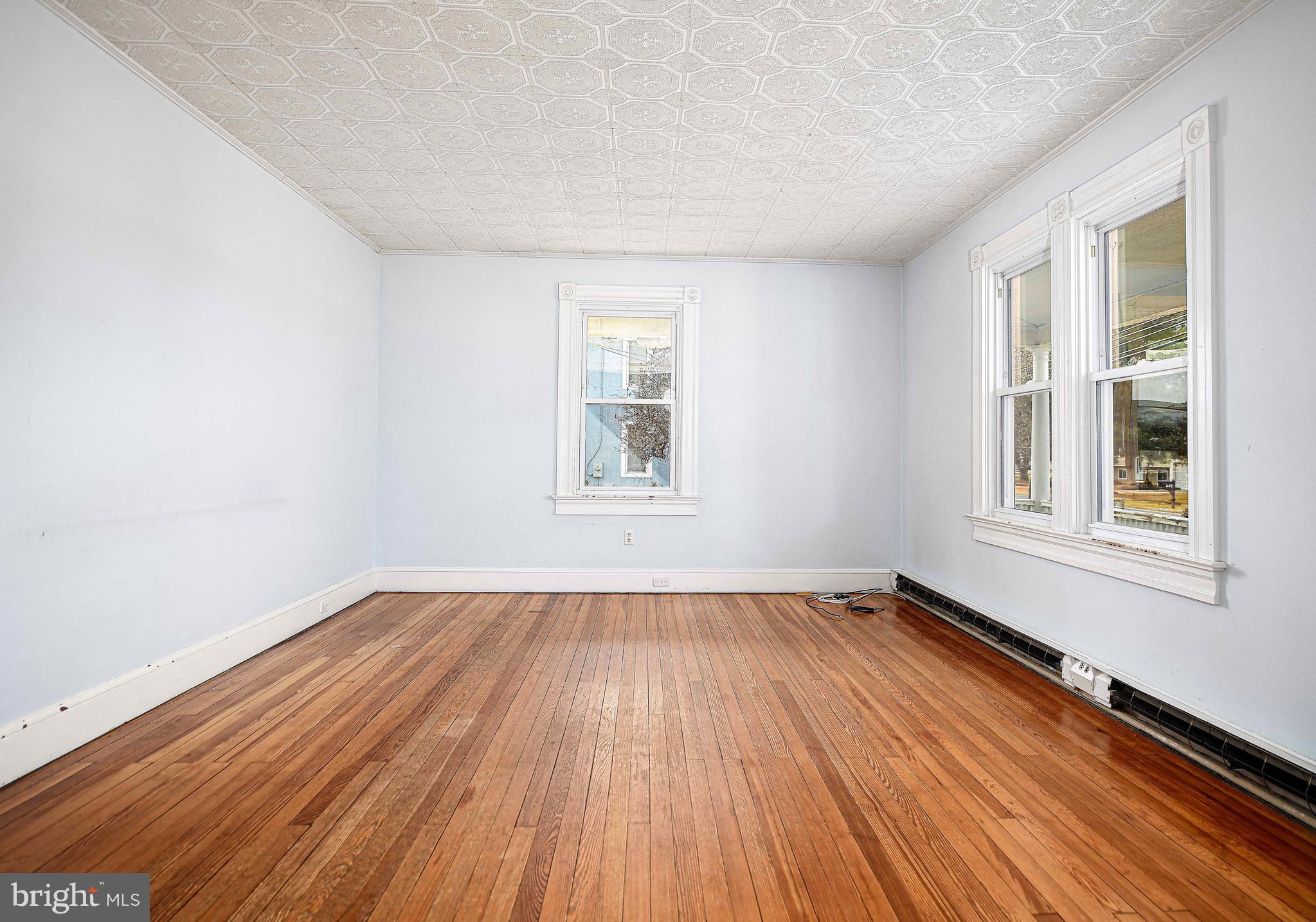 1531 Perryman Road Aberdeen, MD 21001 - Photo 7 of 23 a view of an empty room with wooden floor and a window