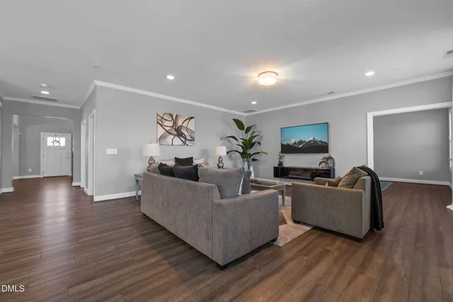 a workspace room with furniture wooden floor and windows