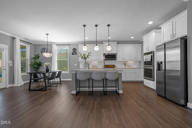 a view of a dining room with furniture and window