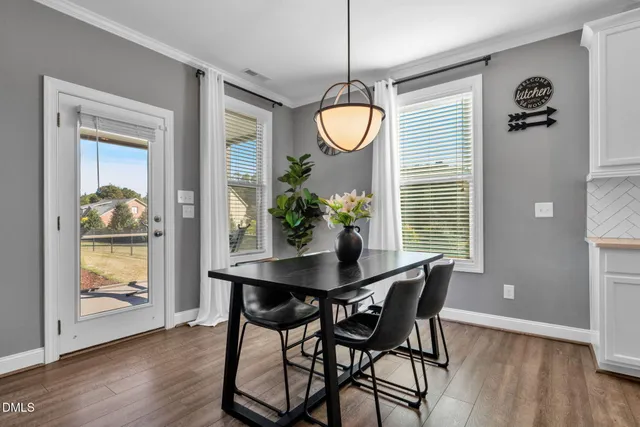 a living room with furniture and a lamp