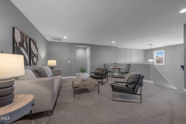 a bathroom with a double vanity sink toilet and mirror