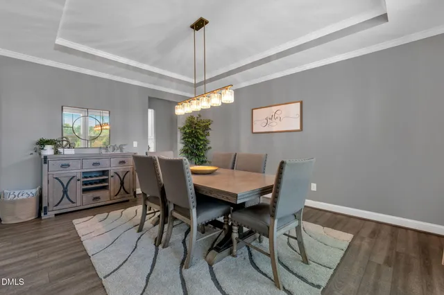 a living room with a fireplace and a rug