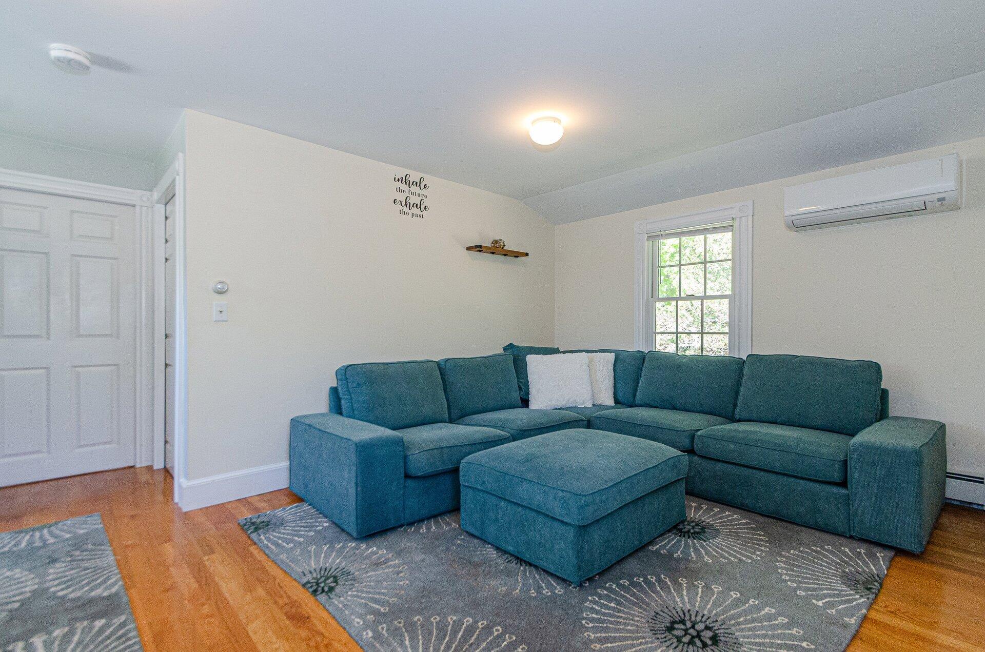1089 Main Street Cotuit, MA 02635 - Photo 30 of 41 a living room with furniture and a window
