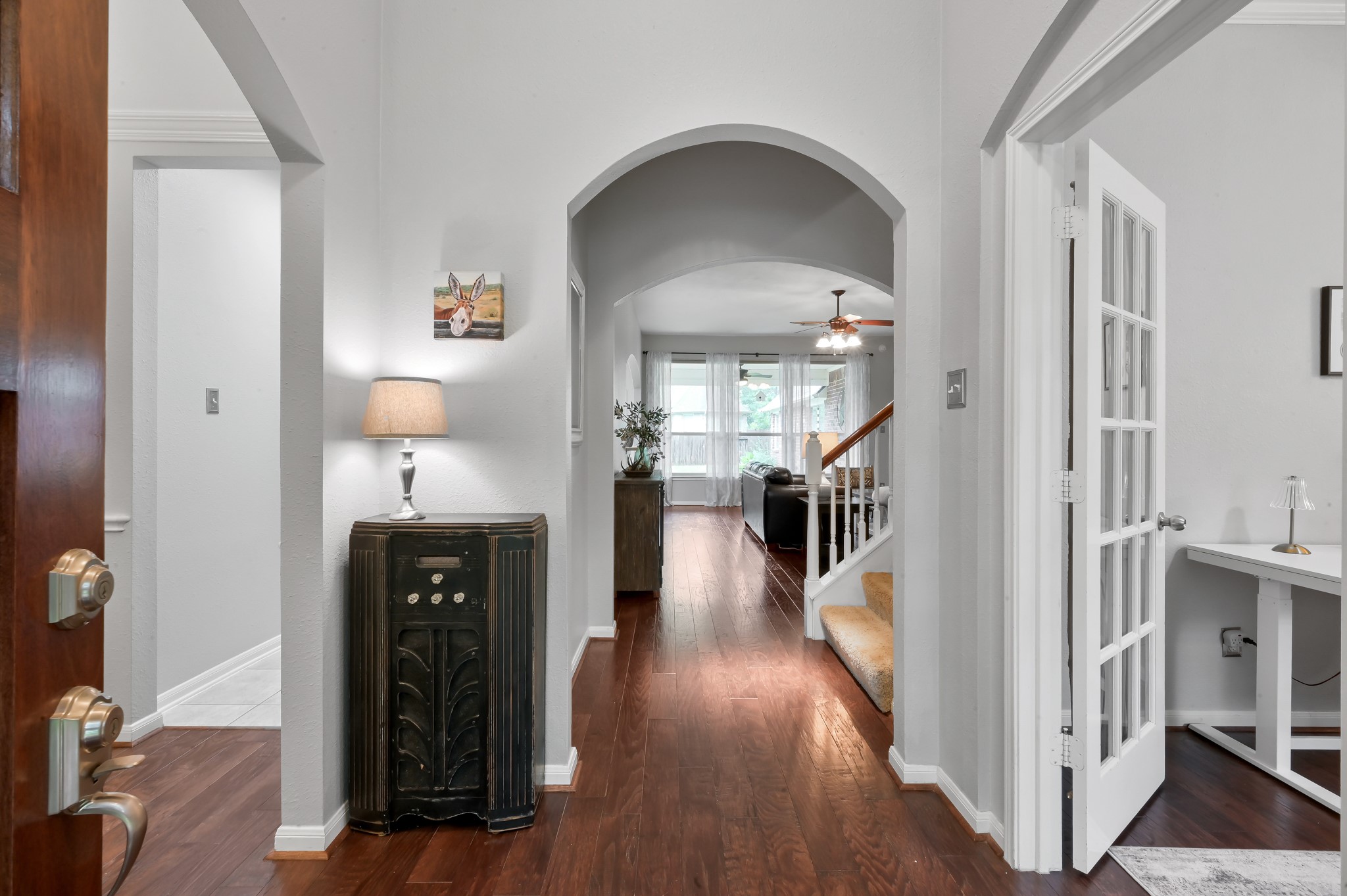 2 Westward Ridge Place The Woodlands, TX 77384 - Photo 13 of 43 Another inviting archway leads into the spacious living room and open-concept kitchen