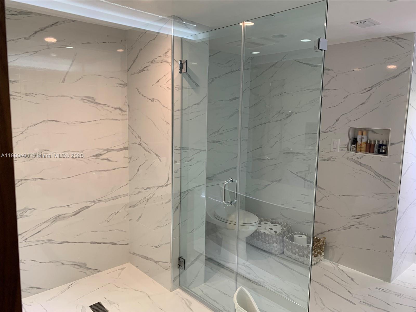 9401 Collins Avenue, Unit 305 Surfside, FL 33154 - Photo 13 of 17 a bathroom with a shower