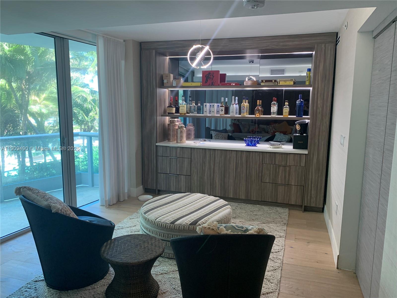 9401 Collins Avenue, Unit 305 Surfside, FL 33154 - Photo 8 of 17 a room with table chair and window