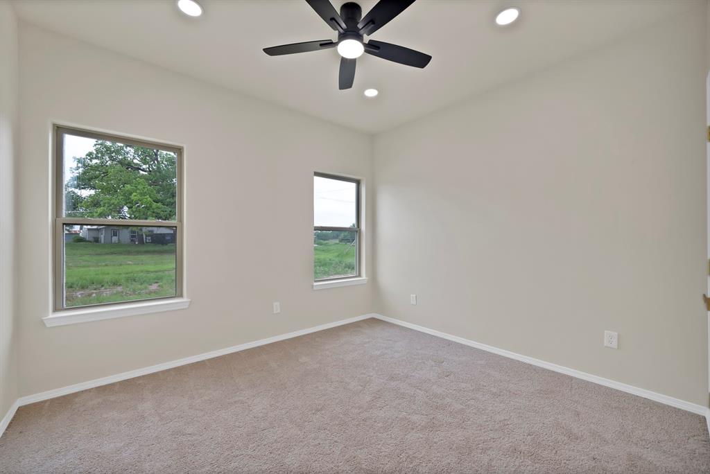 501 Harris Road Azle, TX 76020 - Photo 15 of 29 an empty room with windows and closet