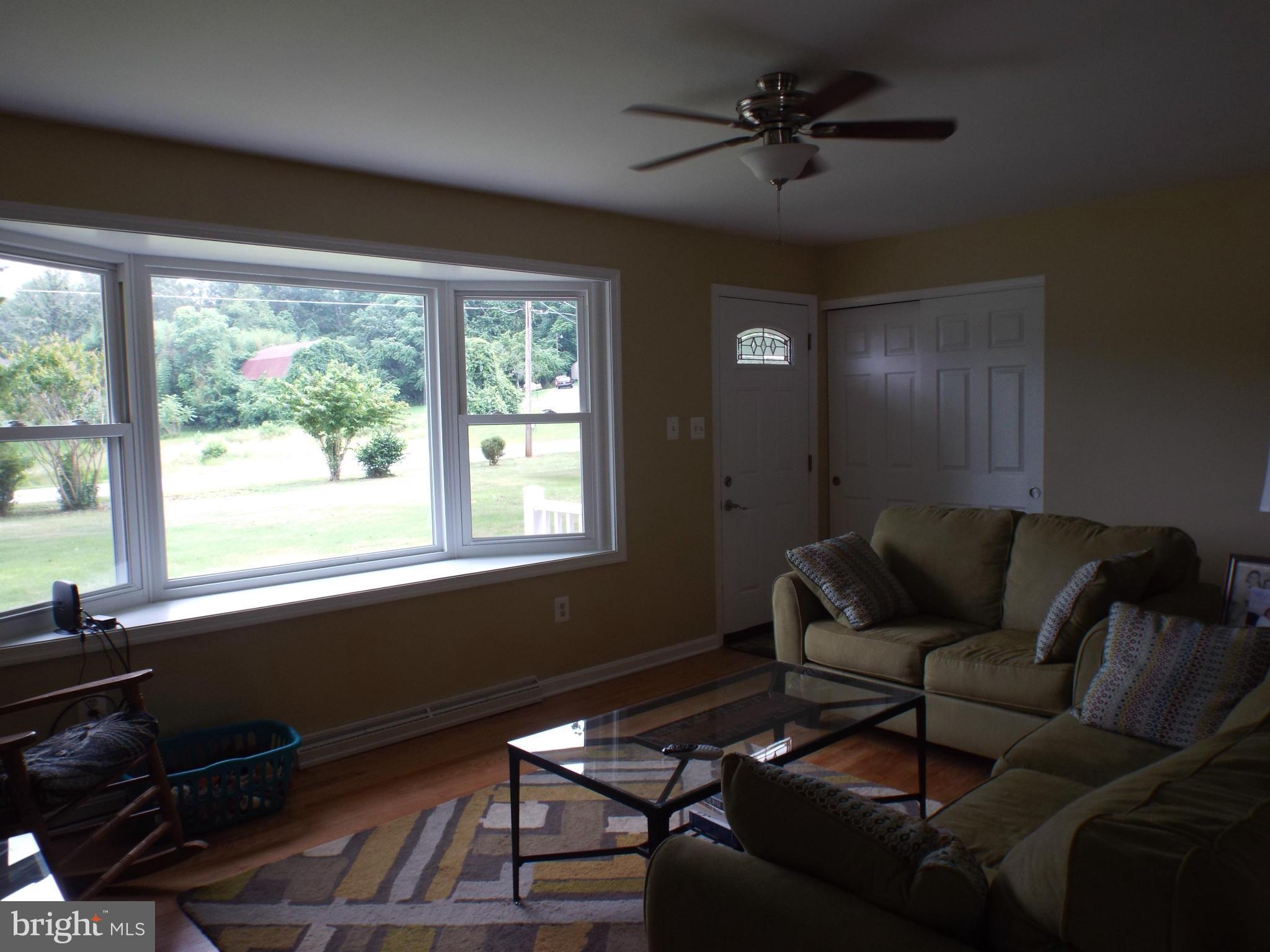 1825 Joe Harris Road Prince Frederick, MD 20678 - Photo 16 of 30 Lg Living Room with pic window, closet and fan