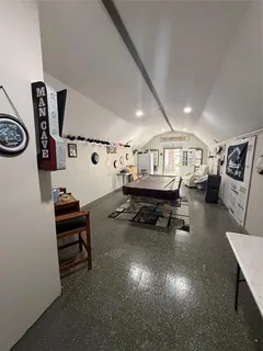 a living room with furniture and a mirror