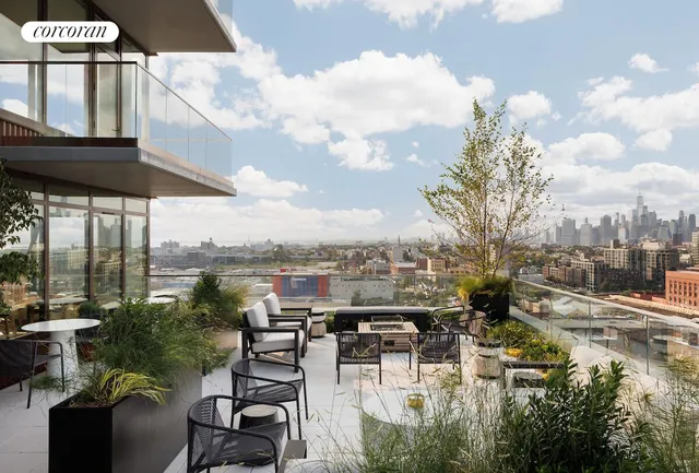 a view of a lake with couches and city view