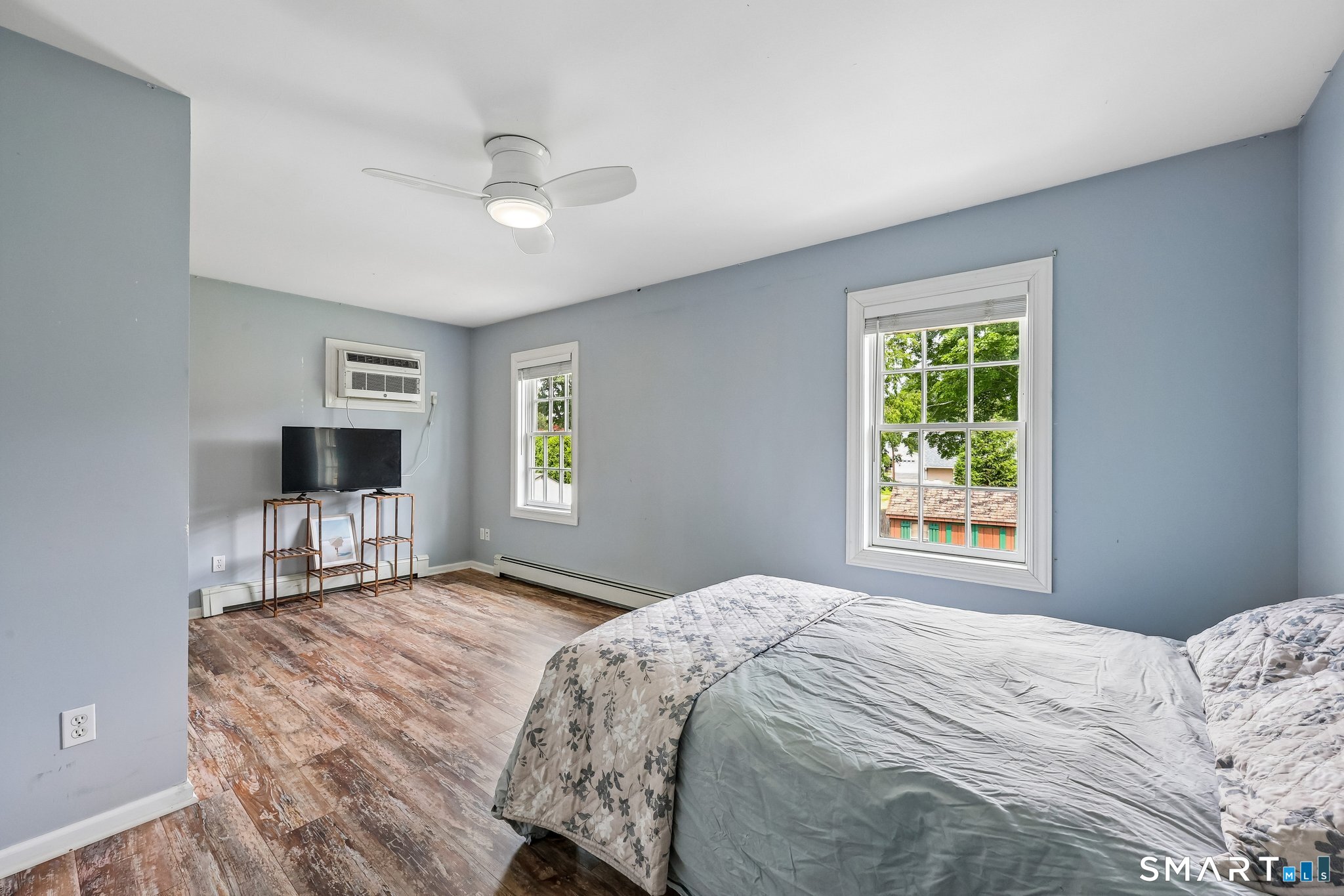 21 Friendly Road Norwalk, CT 06851 - Photo 15 of 28 Another spacious bedroom with an oversized closet and a laundry chute that goes directly to the laundry room on main level! Double windows allow the morning sunlight to come through! Freshly painted with hardwood flooring throughout!