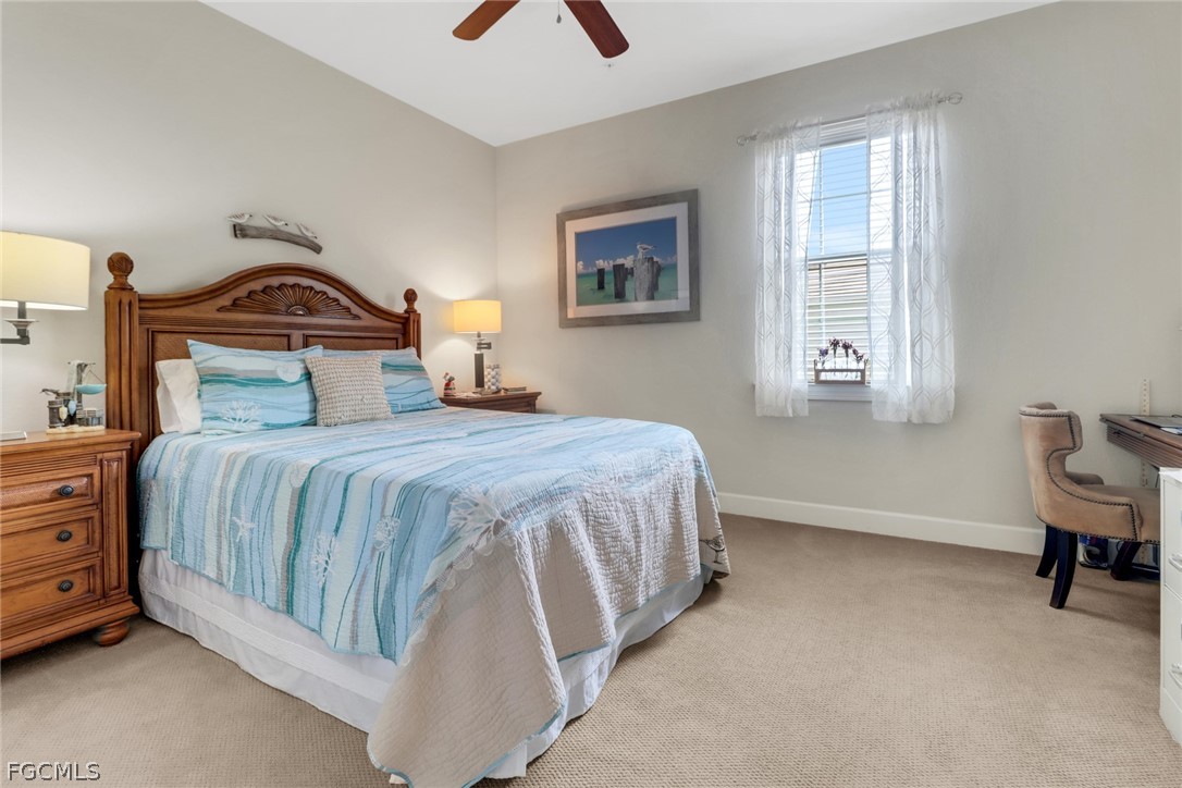 13020 Pebblebrook Point Circle, Unit 202 Fort Myers, FL 33905 - Photo 20 of 40 a bedroom with a bed and a window