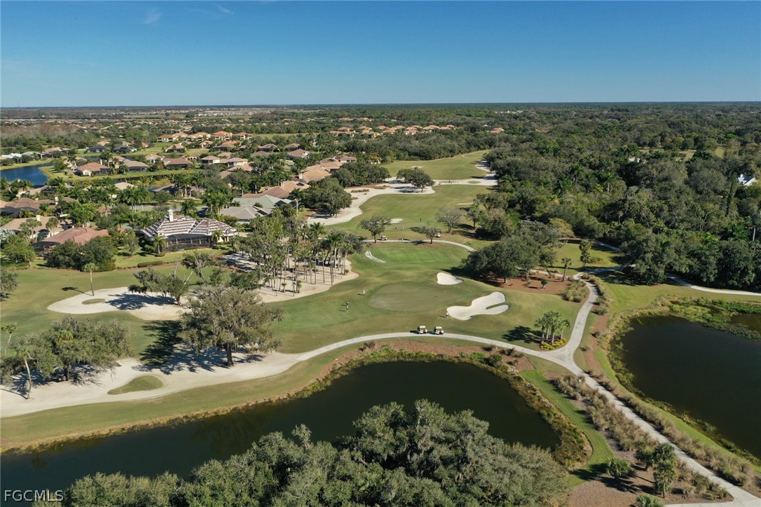 13020 Pebblebrook Point Circle, Unit 202 Fort Myers, FL 33905 - Photo 35 of 40 an aerial view of residential houses with outdoor space and trees all around