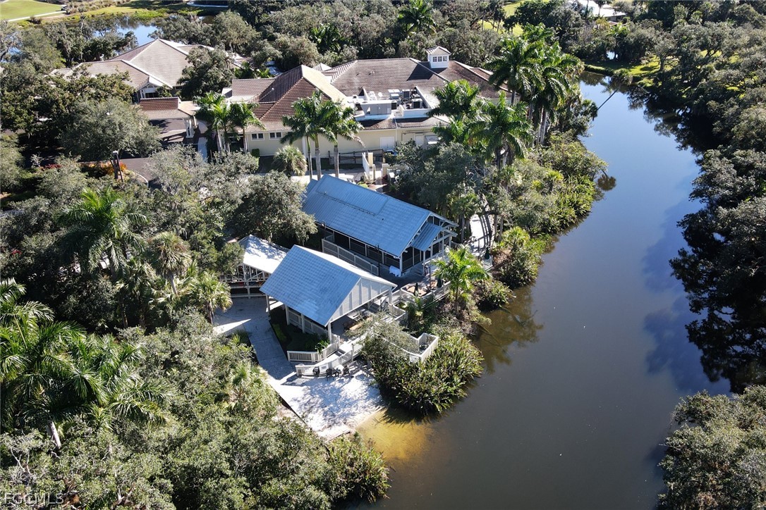 13020 Pebblebrook Point Circle, Unit 202 Fort Myers, FL 33905 - Photo 37 of 40 an aerial view of houses with yard