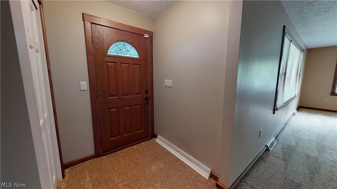 18142 Madison Road Middlefield, OH 44062 - Photo 12 of 35 Front entryway with a coat closet.