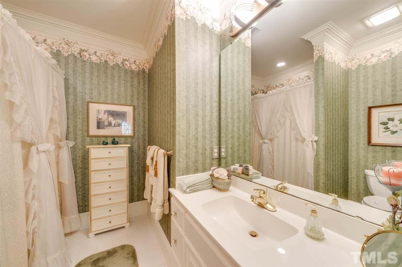 1112 Hymettus Court Raleigh, NC 27607 - Photo 16 of 29 a bathroom with a sink a toilet and shower