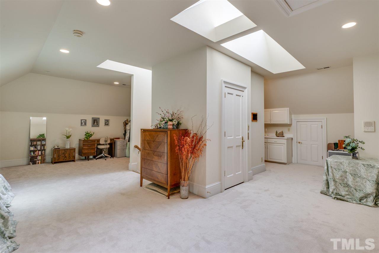 1112 Hymettus Court Raleigh, NC 27607 - Photo 19 of 29 a view of a livingroom with furniture and a garage
