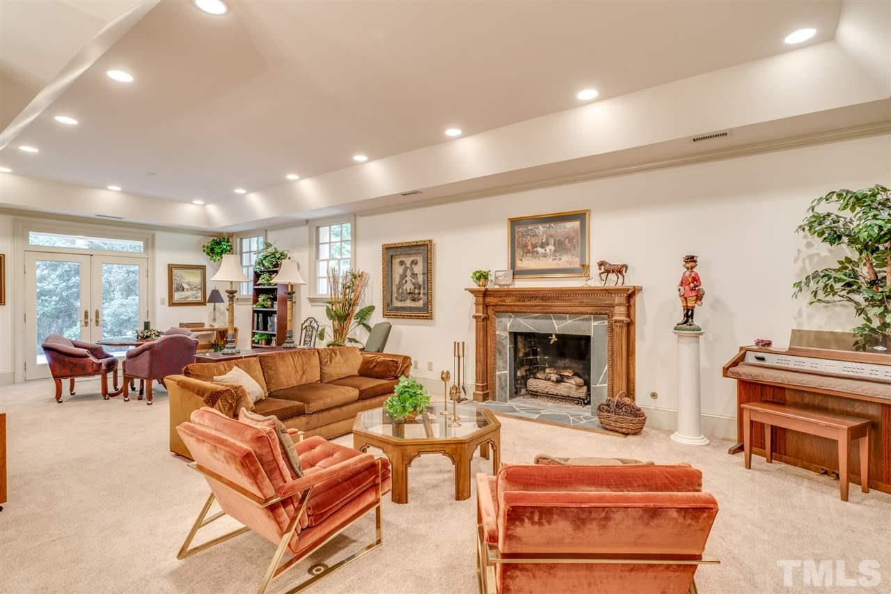 1112 Hymettus Court Raleigh, NC 27607 - Photo 21 of 29 a living room with furniture and a fireplace