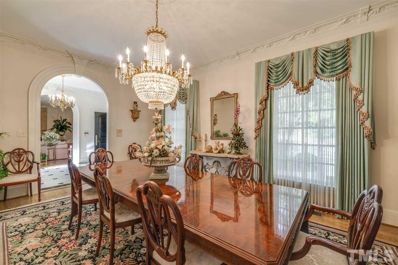 1112 Hymettus Court Raleigh, NC 27607 - Photo 5 of 29 a view of a dining room with furniture and chandelier