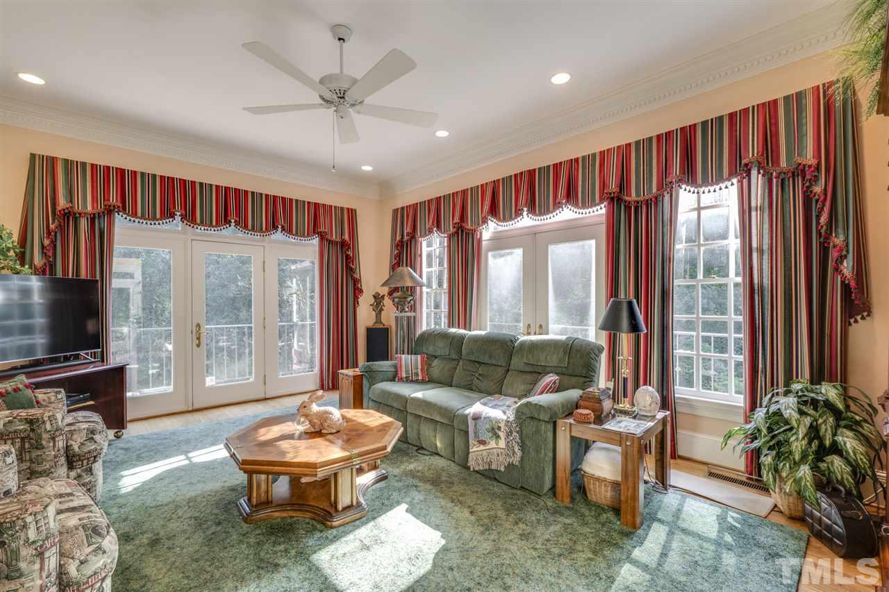 1112 Hymettus Court Raleigh, NC 27607 - Photo 8 of 29 a living room with furniture and a large window