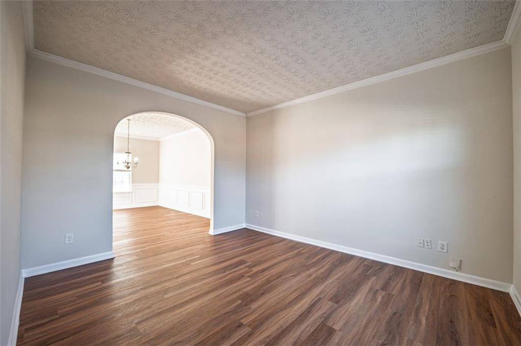 3017 Bellingham Way Lithia Springs, GA 30122 - Photo 15 of 44 an empty room with wooden floor and windows