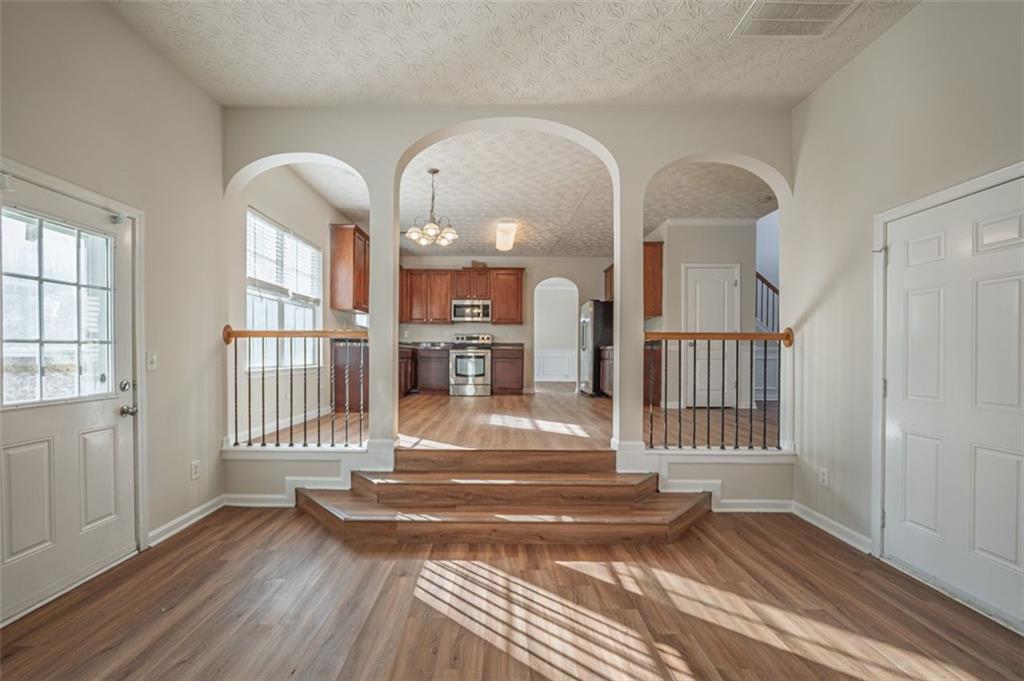 3017 Bellingham Way Lithia Springs, GA 30122 - Photo 20 of 44 a view of entryway and hall with wooden floor