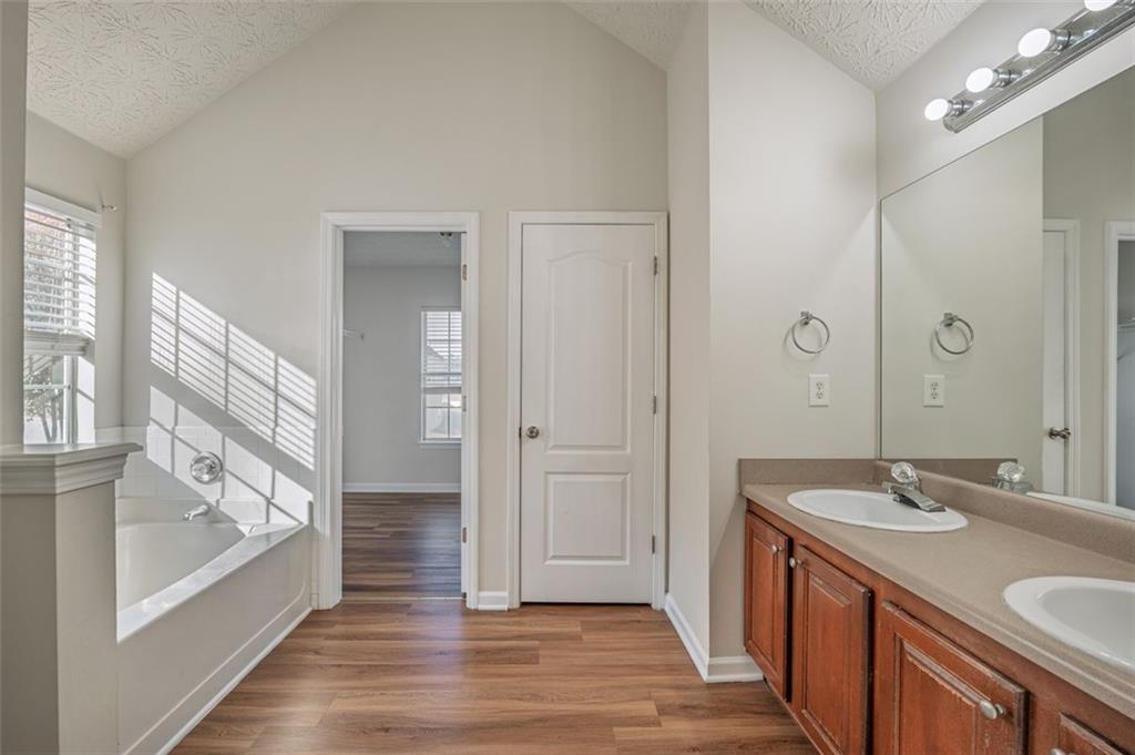 3017 Bellingham Way Lithia Springs, GA 30122 - Photo 26 of 44 a bathroom with a sink and a mirror