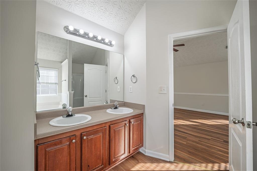 3017 Bellingham Way Lithia Springs, GA 30122 - Photo 28 of 44 a bathroom with a sink double vanity and a mirror