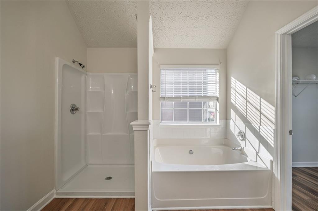 3017 Bellingham Way Lithia Springs, GA 30122 - Photo 29 of 44 a bathroom with a bathtub