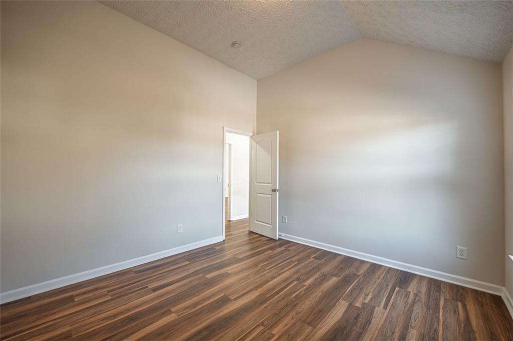 3017 Bellingham Way Lithia Springs, GA 30122 - Photo 33 of 44 a view of an empty room with wooden floor