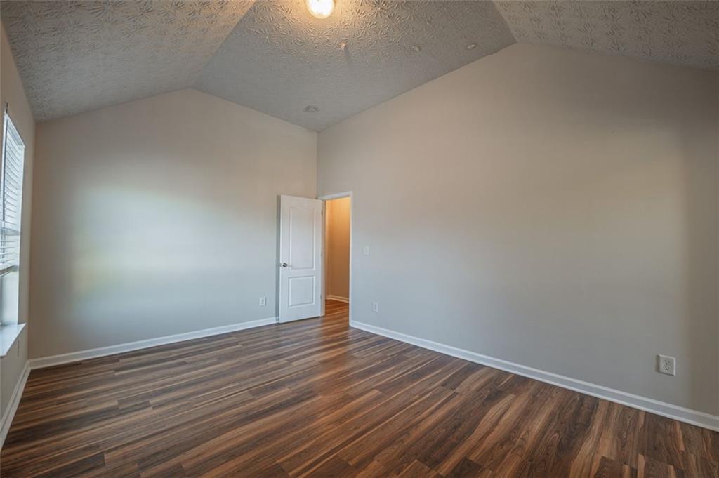 3017 Bellingham Way Lithia Springs, GA 30122 - Photo 35 of 44 a view of an empty room with wooden floor