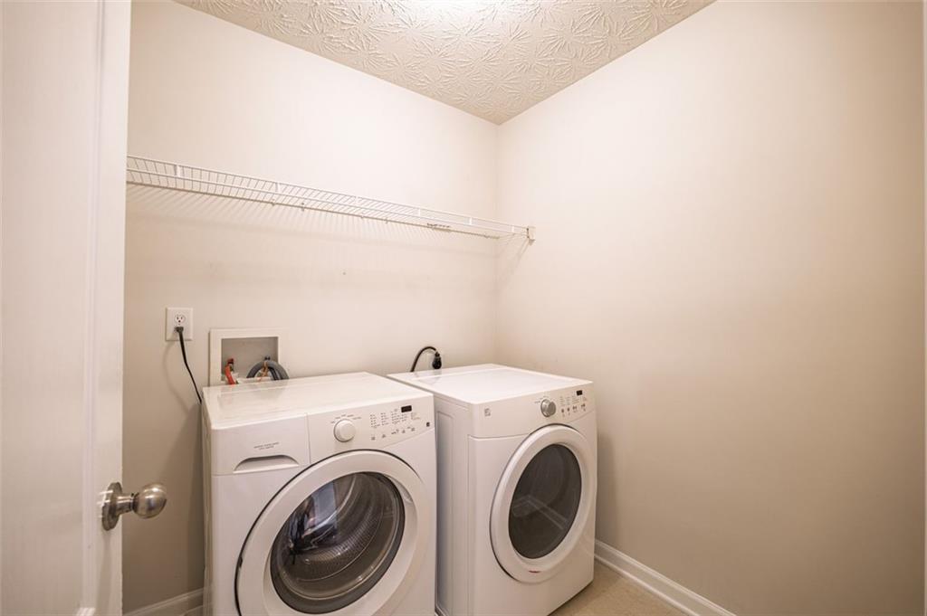 3017 Bellingham Way Lithia Springs, GA 30122 - Photo 37 of 44 a utility room with dryer and washer