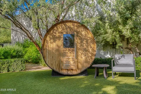 a living room with furniture a rug and a large window