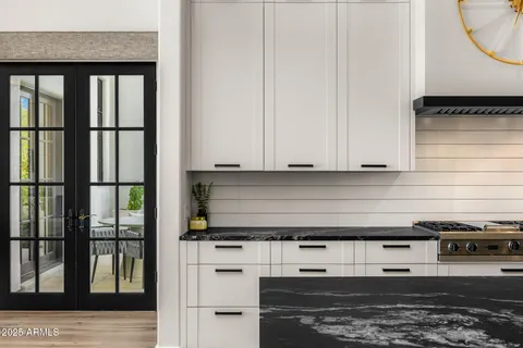 a kitchen with stainless steel appliances granite countertop a sink and a refrigerator