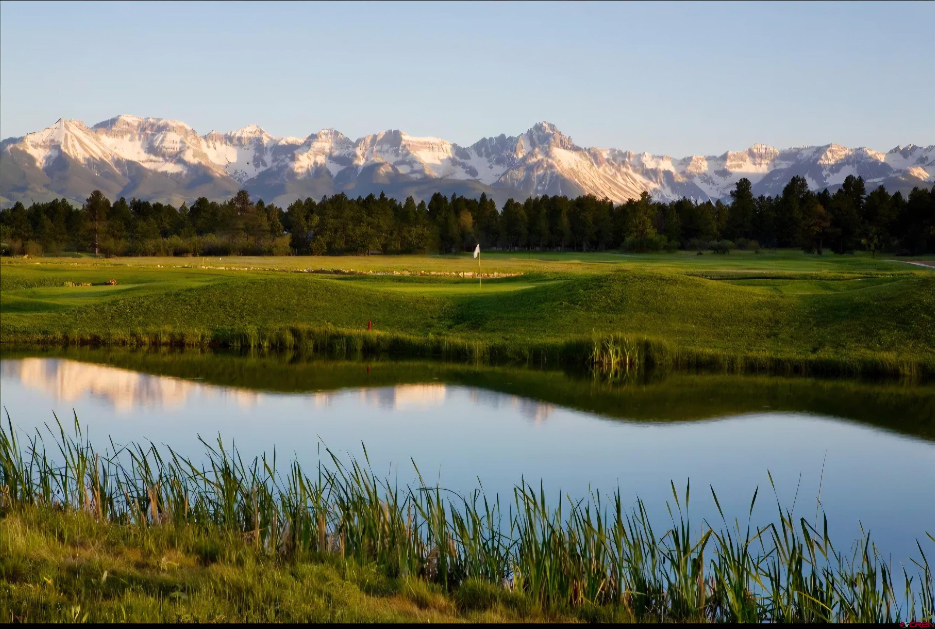 653 Marmot Drive Ridgway, CO 81432 - Photo 42 of 44 a view of a lake with a mountain in the background