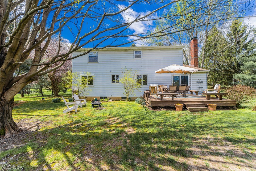 16775 Snyder Road Chagrin Falls, OH 44023 - Photo 25 of 31 Rear view of property featuring a wooden deck and a yard