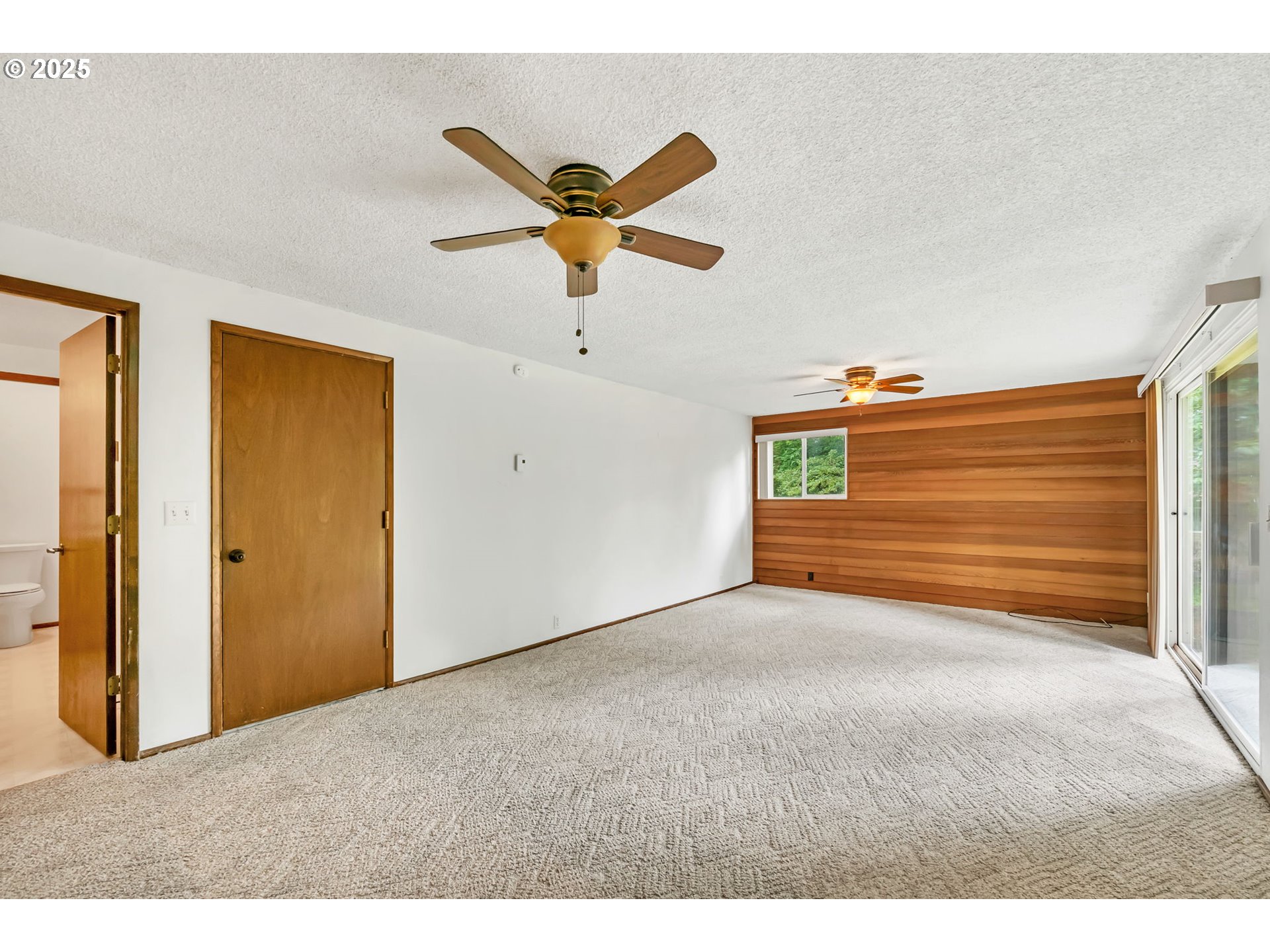 2811 Greentree Way Eugene, OR 97405 - Photo 14 of 38 a view of a room with a ceiling fan and a window