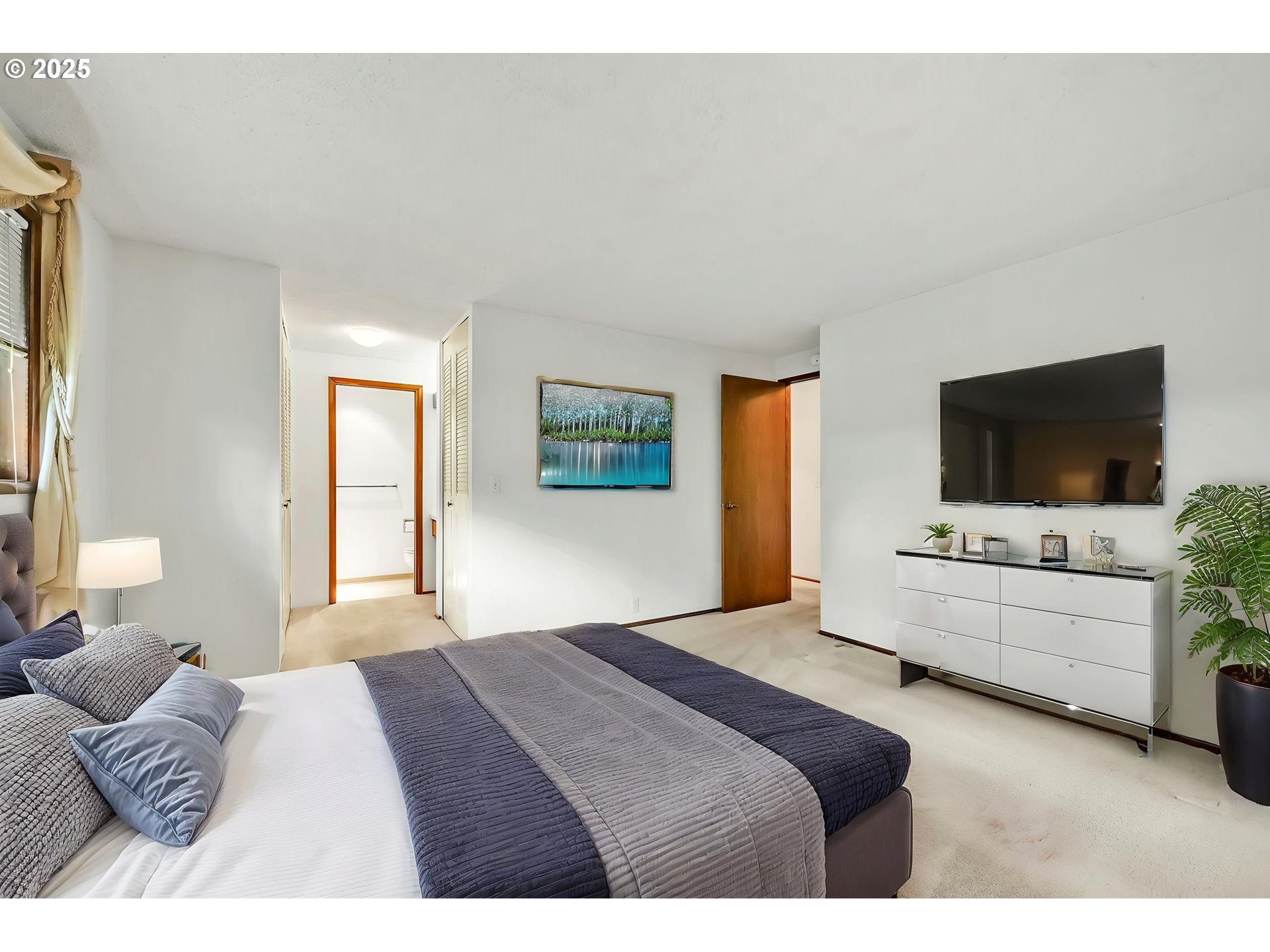 2811 Greentree Way Eugene, OR 97405 - Photo 24 of 38 a bedroom with a bed and a flat screen tv