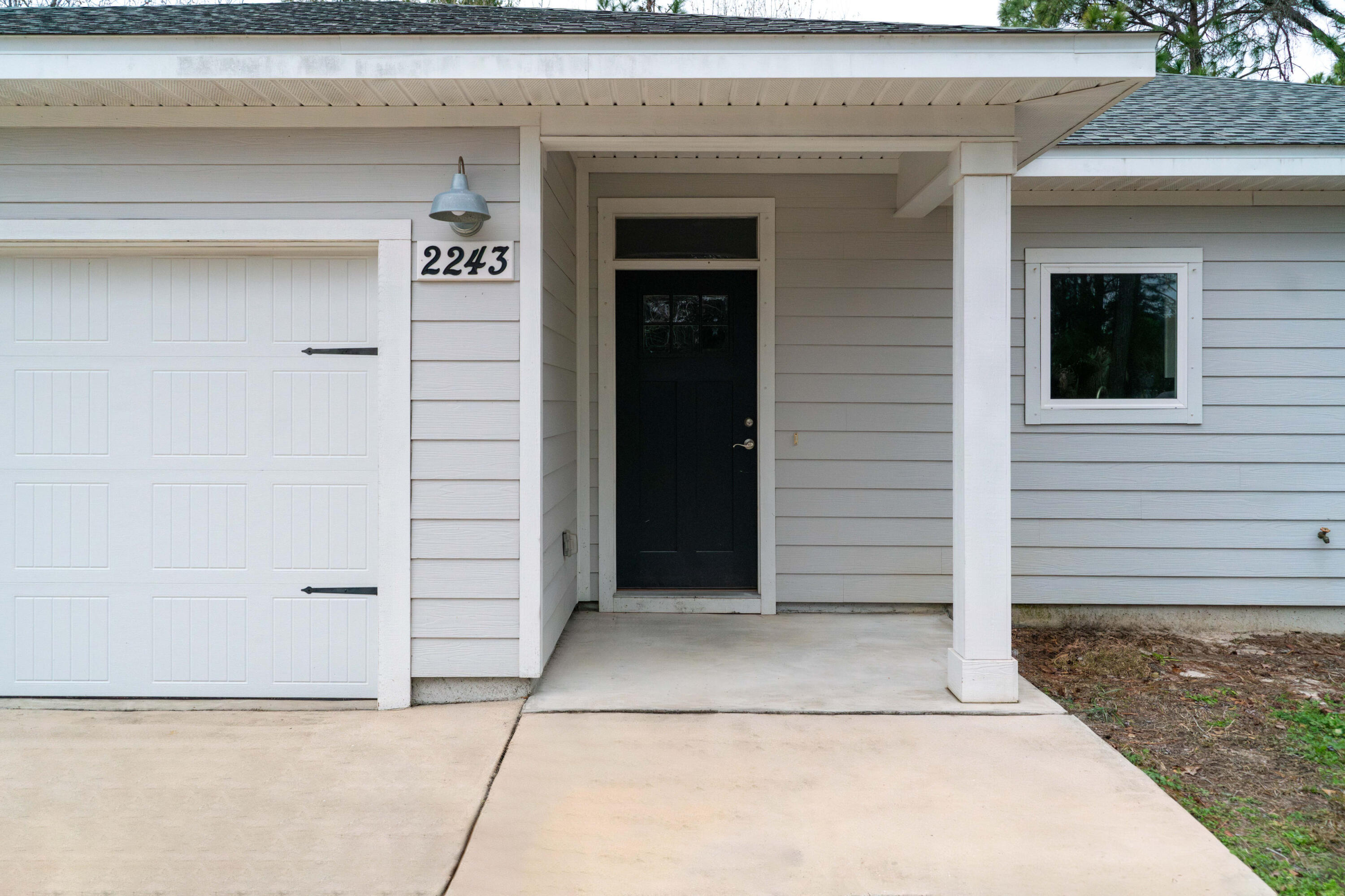 2243 Wind Trace Road North Navarre, FL 32566 - Photo 2 of 34 a view of entrance gate of the house