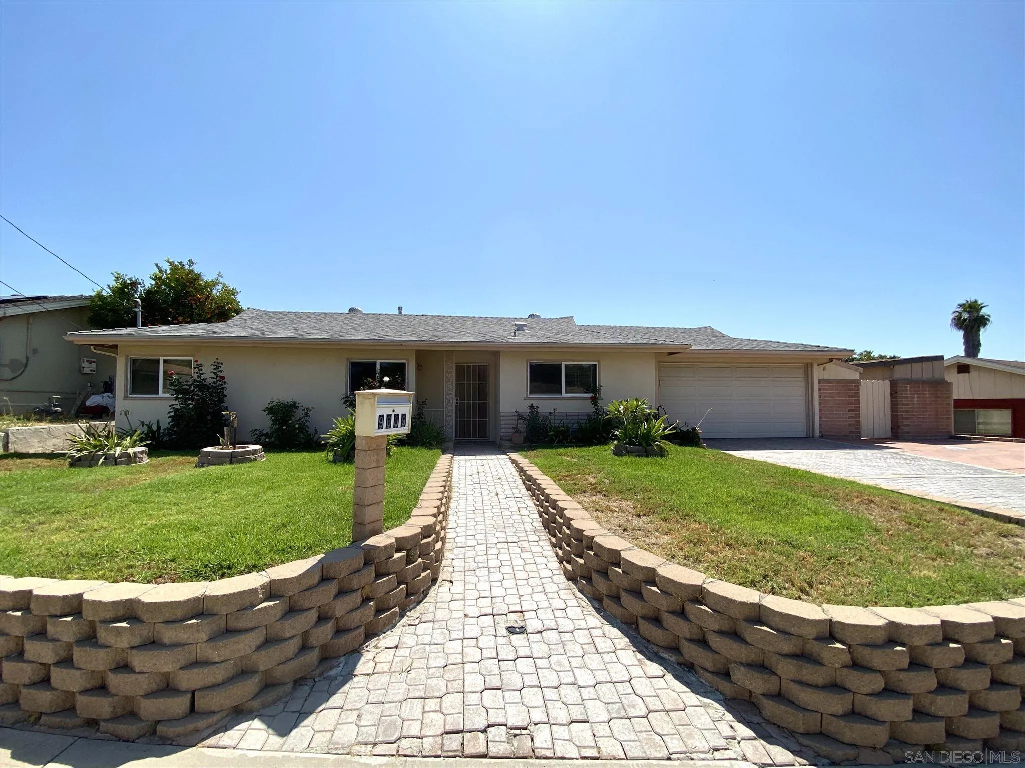 9609 Vomac Road Santee, CA 92071 - Photo 1 of 10 a view of a house with a back yard