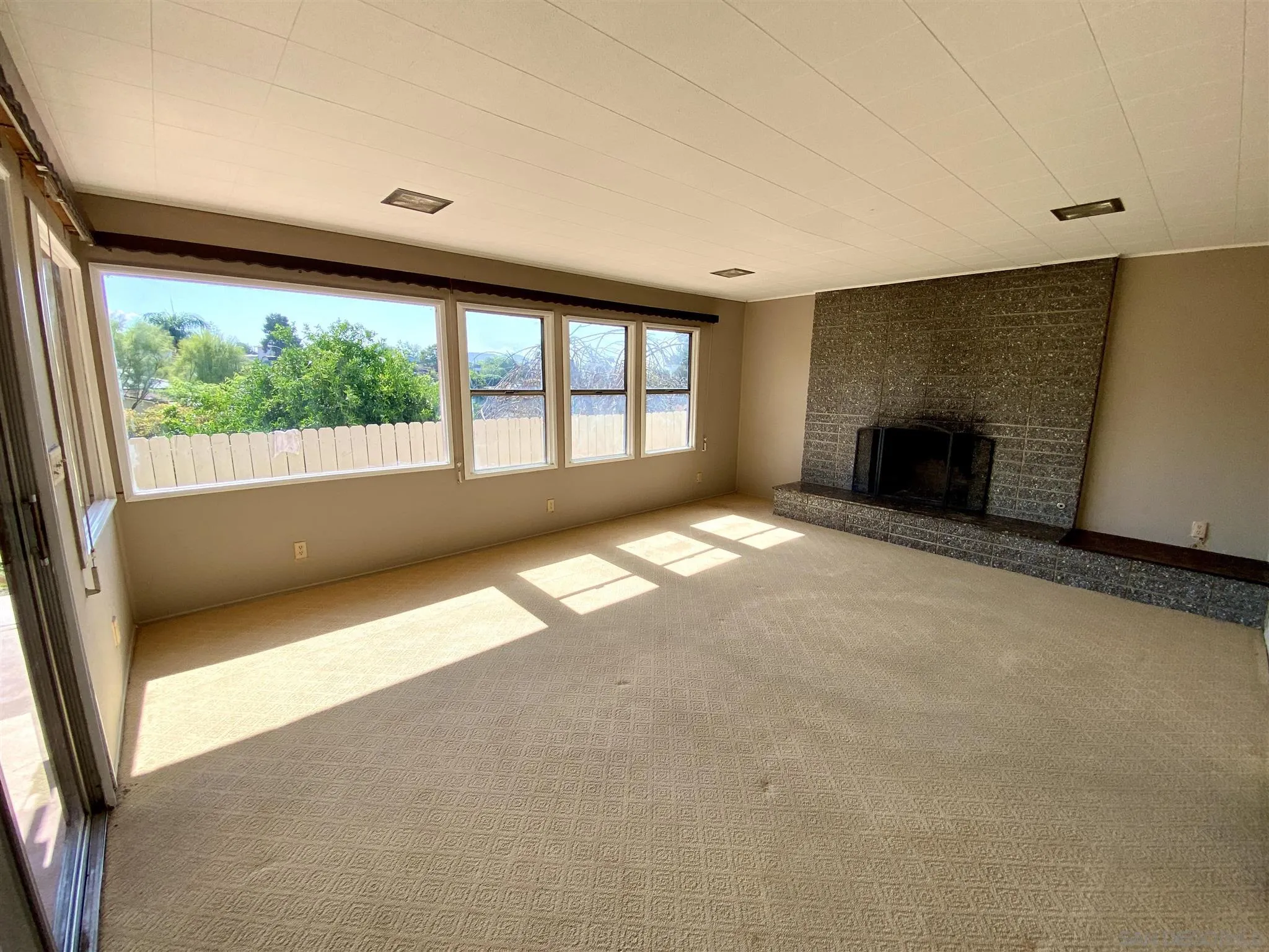 9609 Vomac Road Santee, CA 92071 - Photo 4 of 10 an empty room with windows