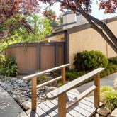an empty room with windows and fireplace