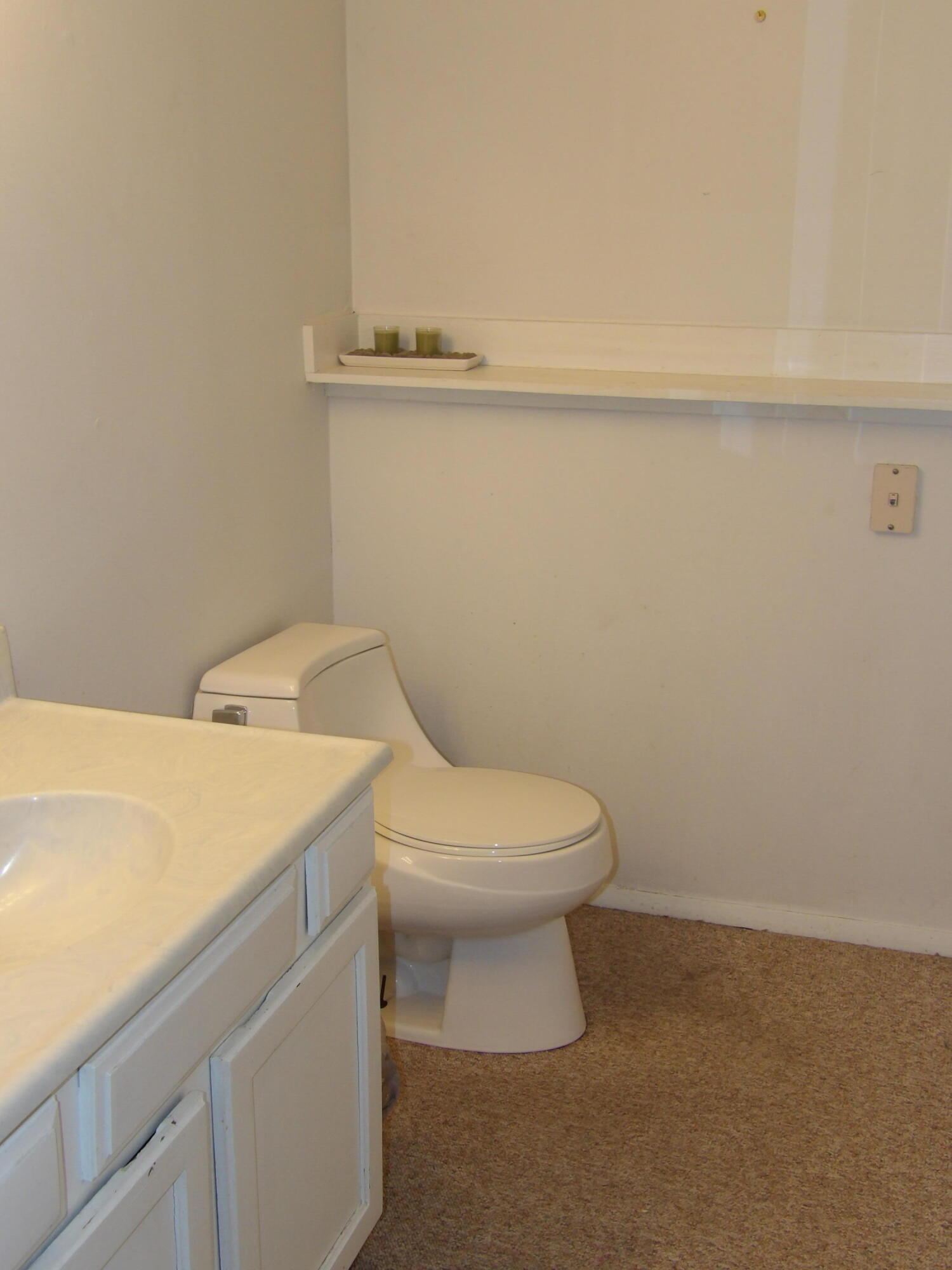 79 Maple Court Hebron, IN 46341 - Photo 11 of 19 a white toilet sitting next to a white sink