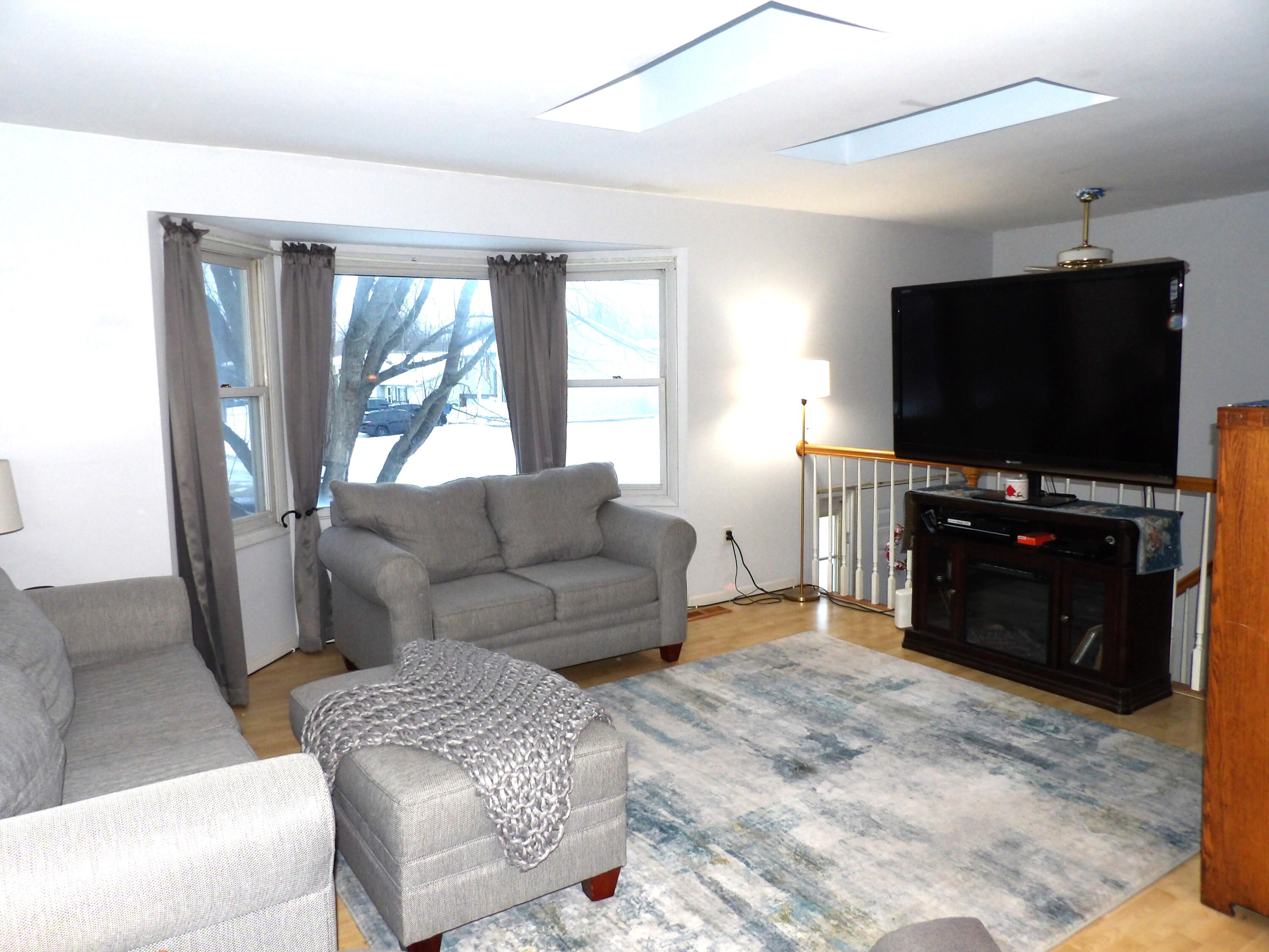 79 Maple Court Hebron, IN 46341 - Photo 2 of 19 a living room with furniture and a flat screen tv
