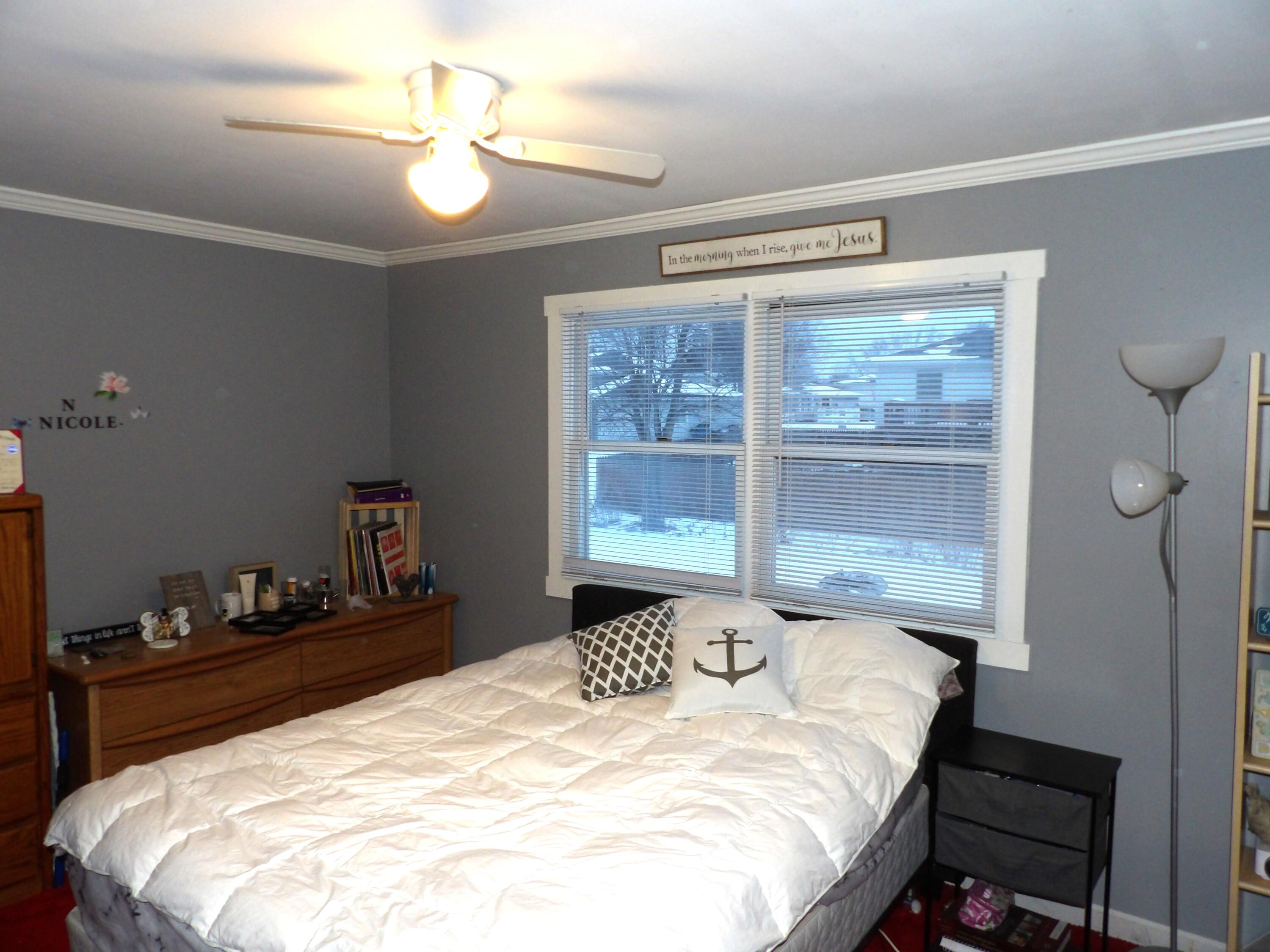 79 Maple Court Hebron, IN 46341 - Photo 9 of 19 a bedroom with a bed and a window