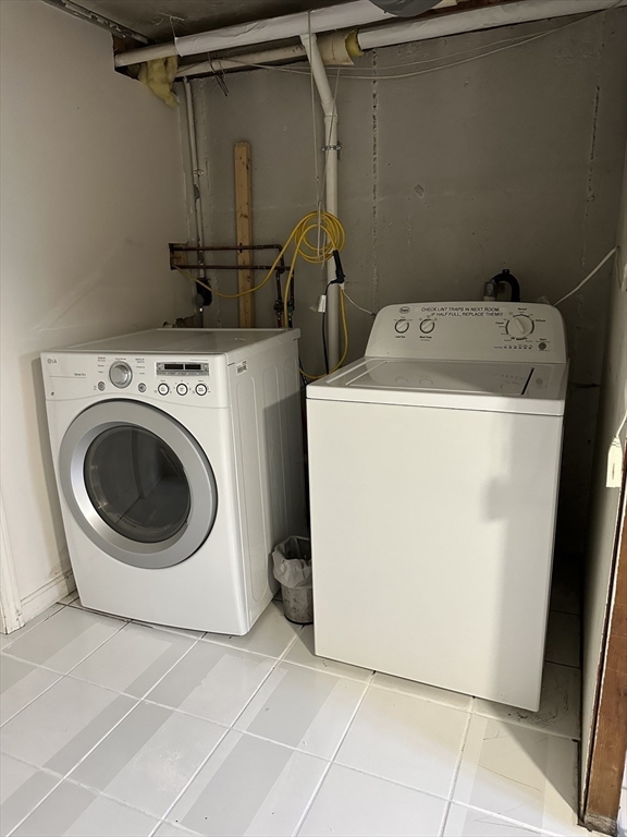 110 Craftsland Road, Unit 110 Newton, MA 02467 - Photo 12 of 14 a utility room with dryer and washer