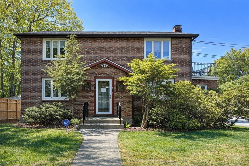 110 Craftsland Road, Unit 110 Newton, MA 02467 - Photo 14 of 14 a front view of a house with garden
