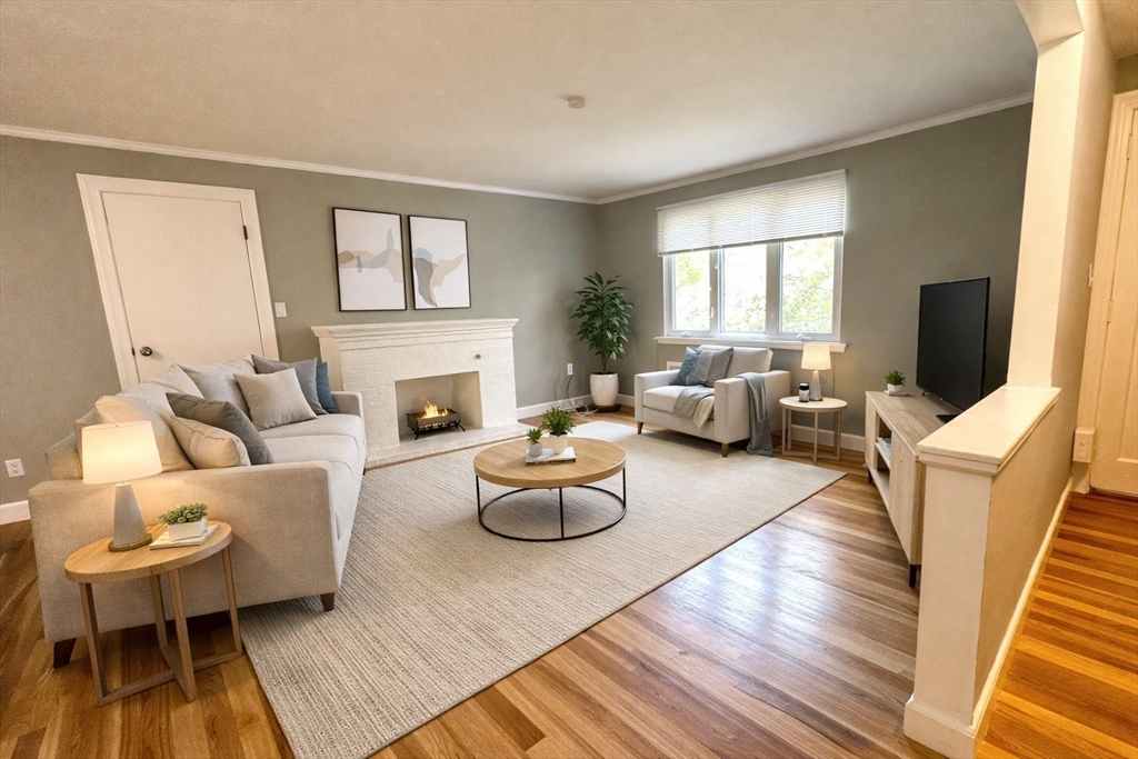 110 Craftsland Road, Unit 110 Newton, MA 02467 - Photo 4 of 14 a living room with furniture fireplace and a window